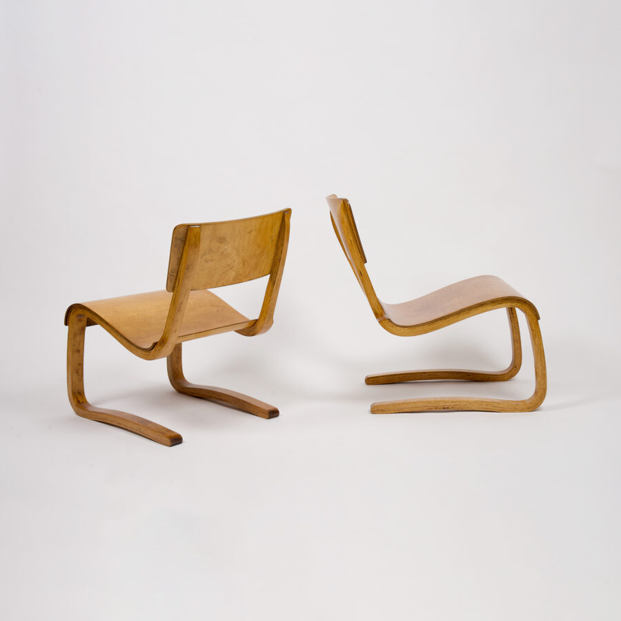 A pair of vintage plywood lounge chairs