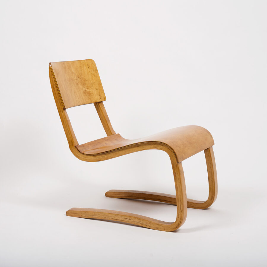 A pair of vintage plywood lounge chairs