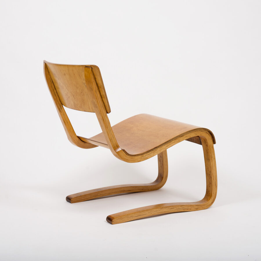 A pair of vintage plywood lounge chairs